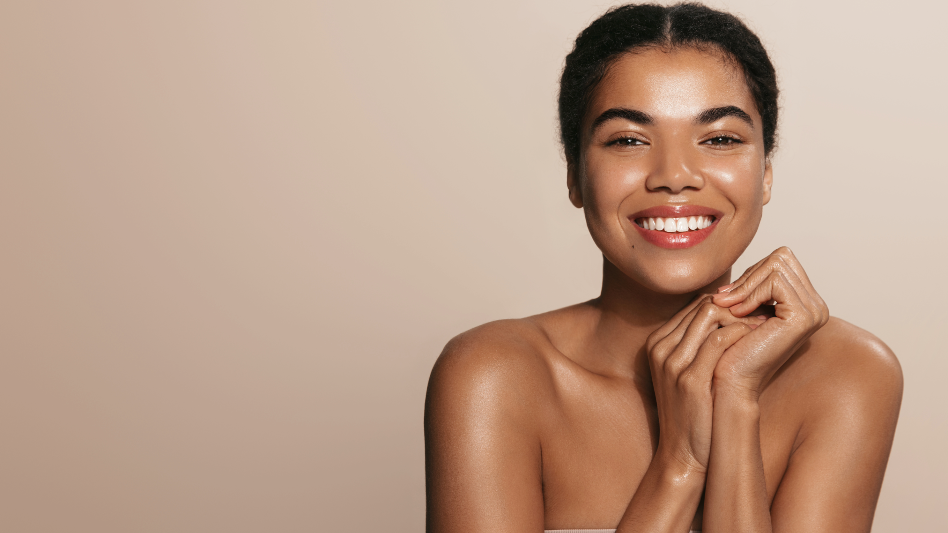 Smiling woman with healthy, glowing skin after a BioRepeel TCA peel treatment